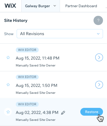 Screenshot of Wix site history. The cursor is over a saved version, with the cursor over the Restore button.