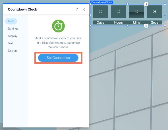 צילום מסך של אפליקציית Wix Countdown Clock ב-Wix Editor. חלונית ההגדרות פתוחה, הכפתור Set Countdown מסומן.