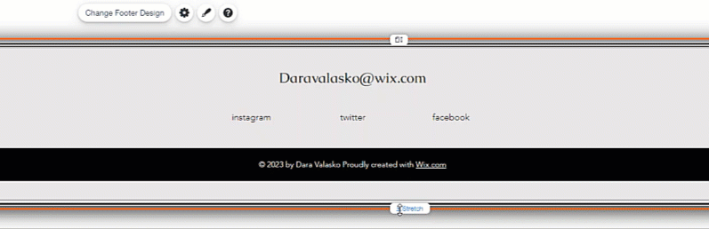 A cursor clicking and dragging the stretch handle of a footer in the Wix Editor.