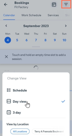 A screenshot showing how to select the Day view in the Booking Calendar on the Wix Owner app.