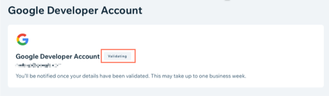 צילום מסך של טאב חשבונות המפתחים בדאשבורד האפליקציה הממותגת עם סטטוס 'Validating' (מאמת) עבור גוגל.