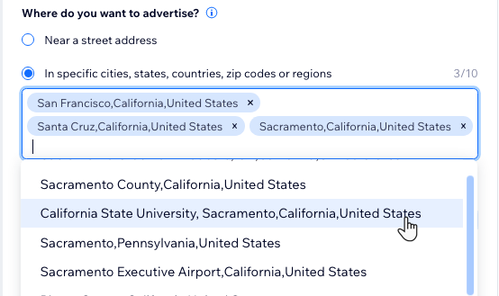 Screenshot del menu a tendina per scegliere dove fare pubblicità che mostra diverse città in California.