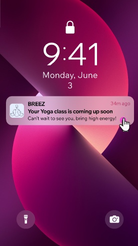 An image of a phone lock screen with a push notification from Breez yoga that says 'Your yoga class is coming up soon.'