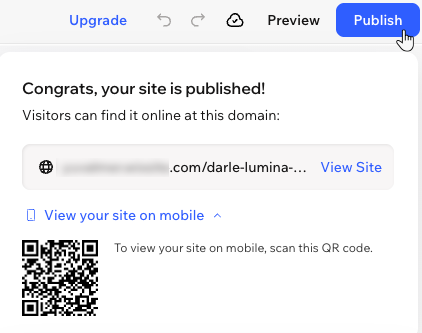 The pop-up that appears after publishing your site in the Wix Harmony Editor, showing the URL and QR code for mobile preview