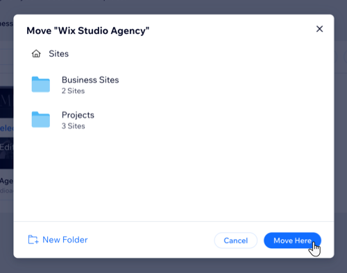 Captura de tela de um site sendo movido para fora de uma pasta na aba Sites do workspace do Wix Studio.