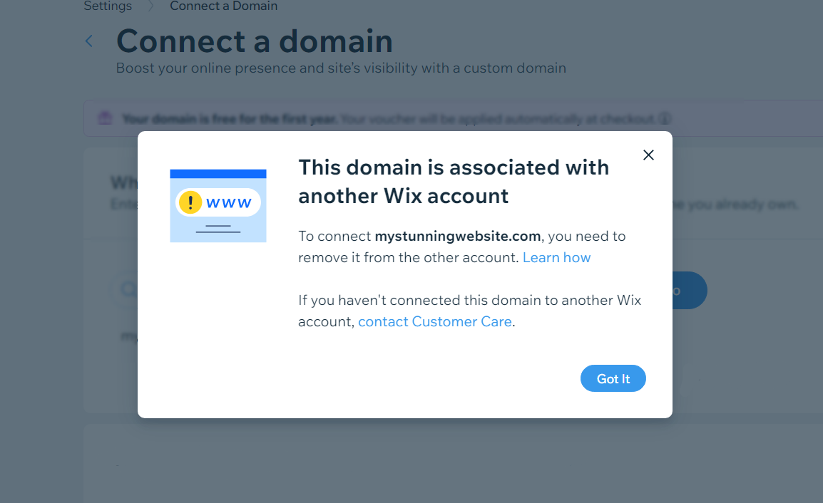 A screenshot from a Wix account showing the error This domain is associated with another Wix account.